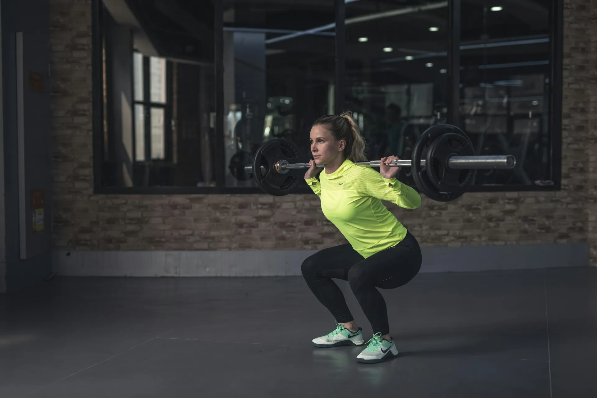 Athlete squatting with barbell